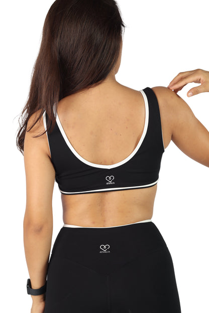 Top deportivo negro con línea blanca - Edge